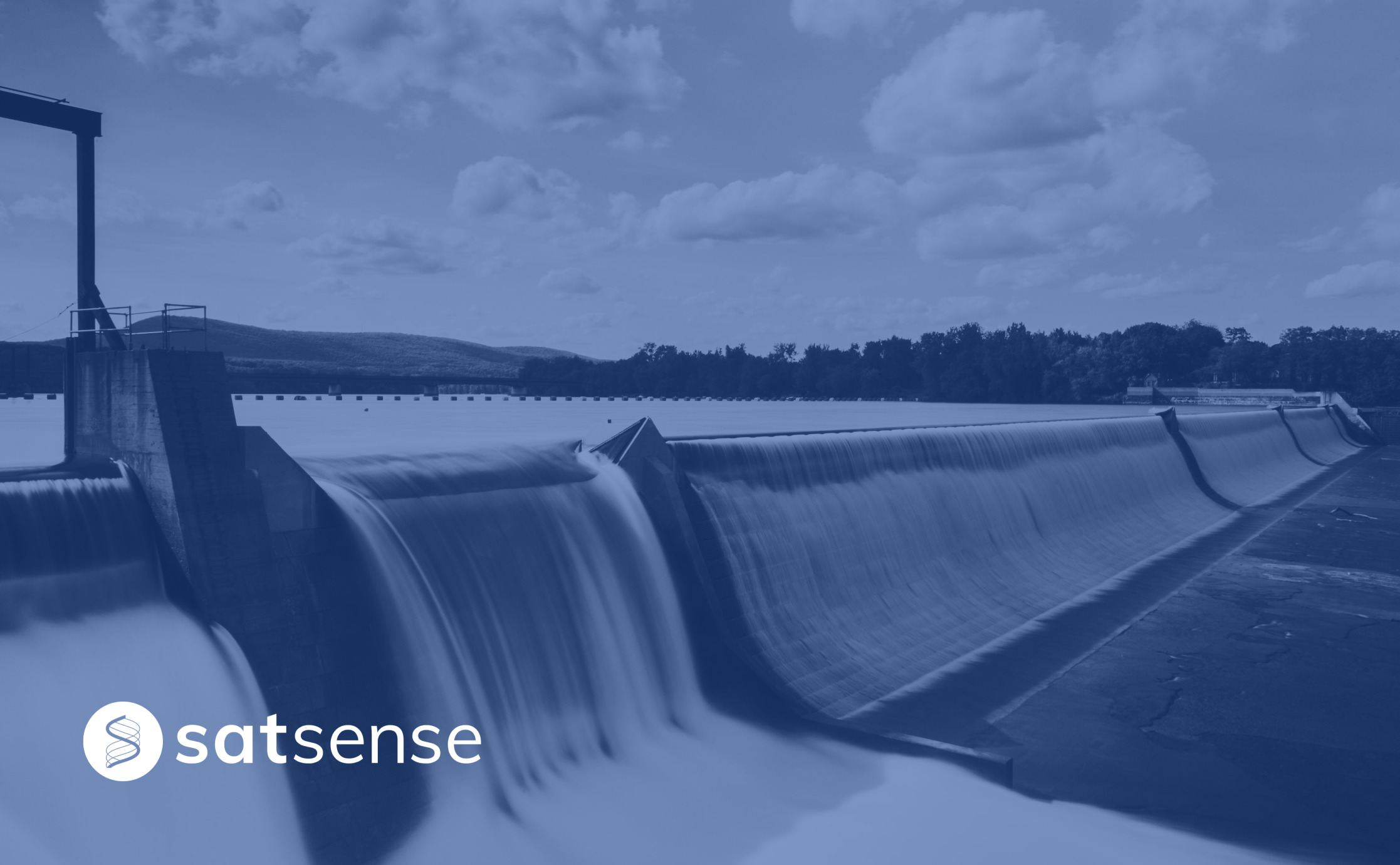 Water flowing from a Dam with SatSense logo on the bottom left corner